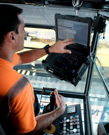 Inside his cabin, at 12 metres from the ground, the crane operator works with high precision.
