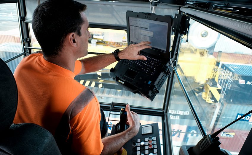 Inside his cabin, at 12 metres from the ground, the crane operator works with high precision.